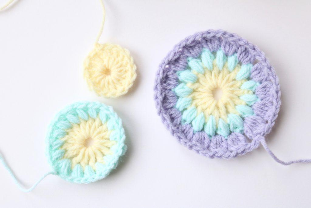 The three first stages of the sunburst granny square sit together on a white background.