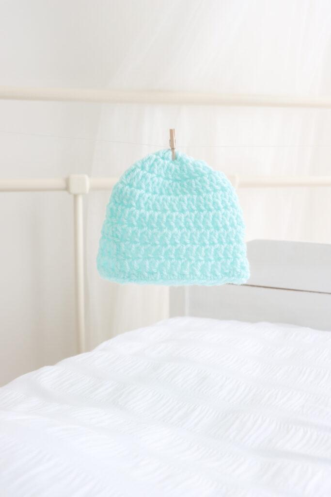 a crochet newborn beanie hat