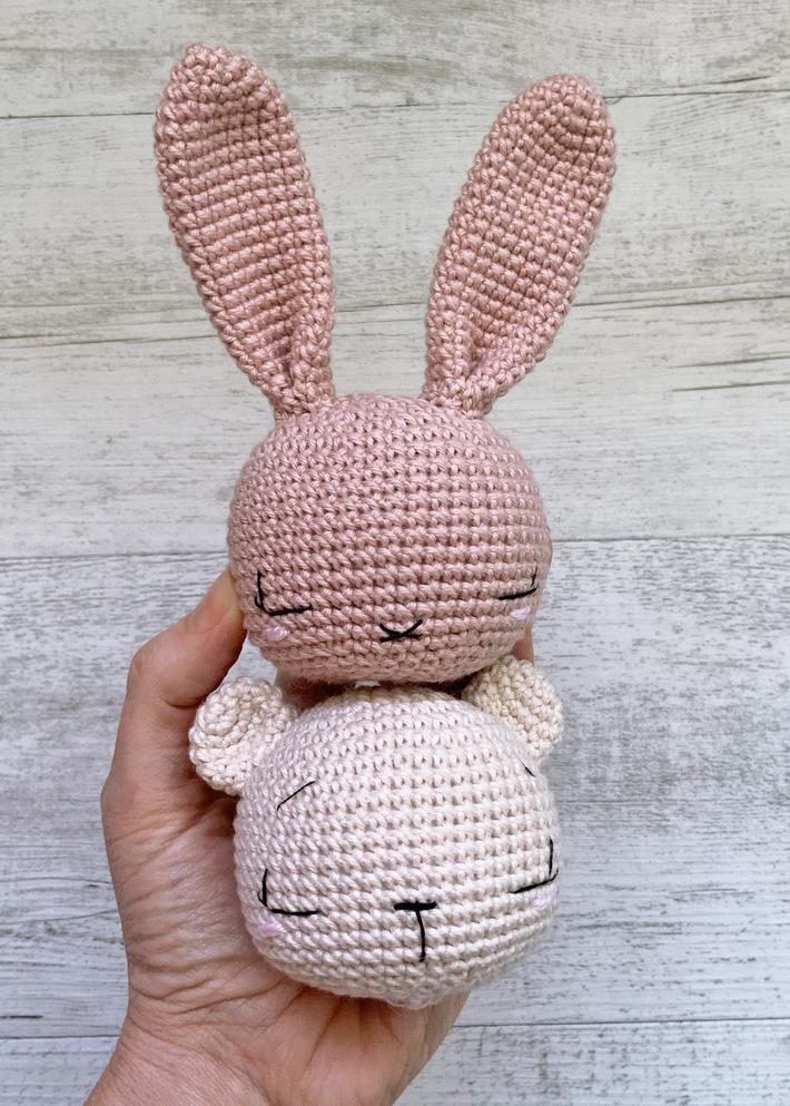 crochet bunny and bear head stacked ontop of one another. 