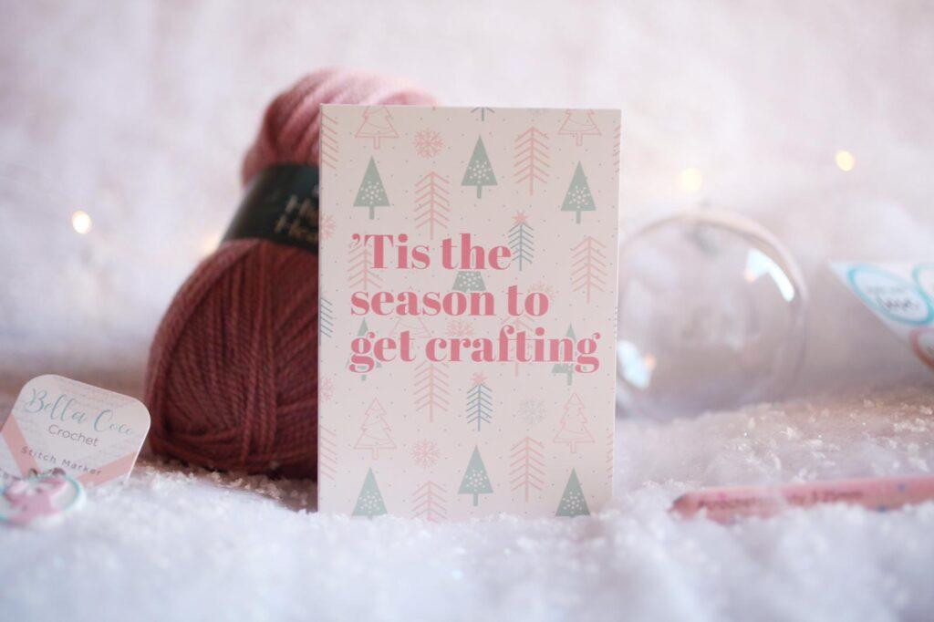 A Christmas card reading, "Tis the season to get crafting" is displayed.