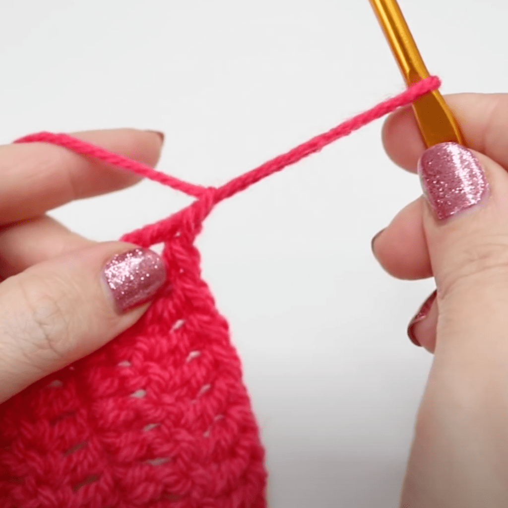 Pulling up a loop at the end of your crochet project.
