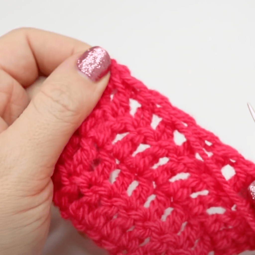 Sewing in the ends of a crochet project.
