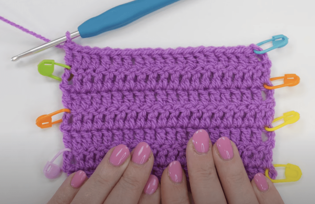 Treble crochet with stitch markers left in the end of each row