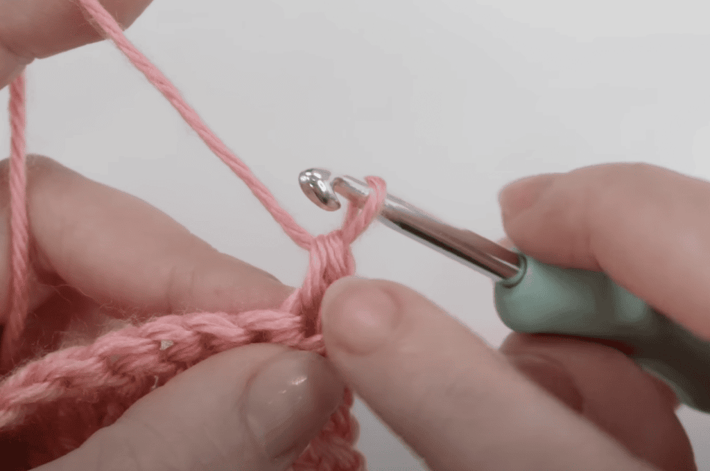 Starting half treble crochet stitch - going into the post to create a stacked double crochet. 