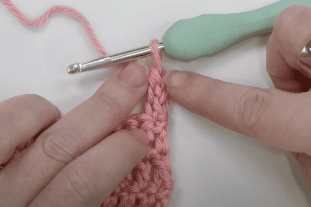 Two double crochets and a treble crochet stacked to create an alternative starting double treble.