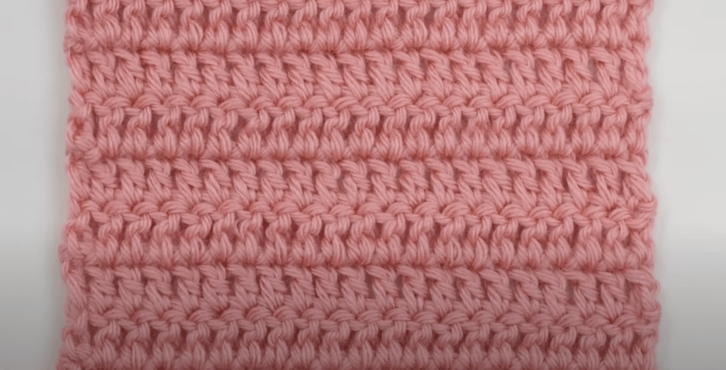 Completed crochet swatch with straight edges.