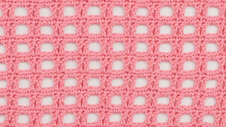 crochet swatch of the sturdy mesh stitch using pink yarn